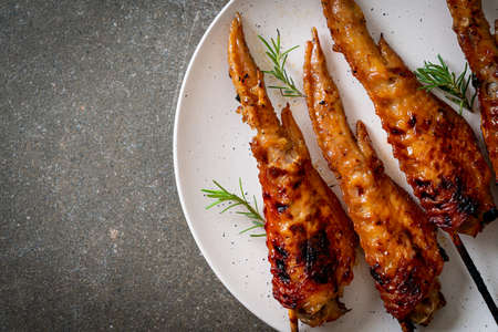 grilled or barbecue chicken wings skewer on plate