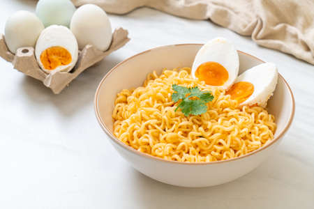 instant noodles bowl with salt eggの写真素材