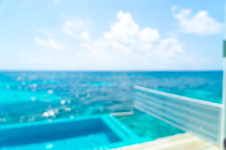 abstract blur and defocused swimming pool and sea background in Maldives
