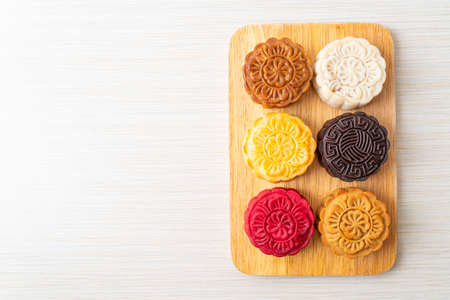colourful Chinese moon cake with mixed flavour on wood plateの写真素材