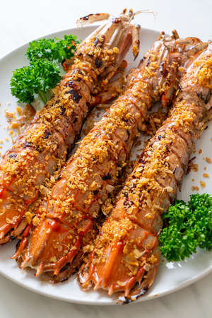 Stir Fried Mantis Shrimp with Garlic on white plate