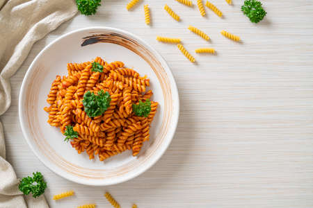 spiral pasta with tomato sauce and parsley - Italian food styleの写真素材