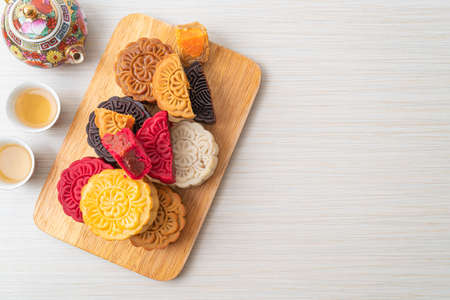 colourful Chinese moon cake with mixed flavour on wood plateの写真素材