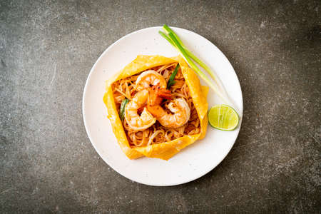 Thai stir fried noodles with shrimps and egg wrap (Pad Thai) - Thai food styleの写真素材