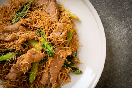 Stir fried rice vermicelli noodle with black soy sauce and pork - Asian food style