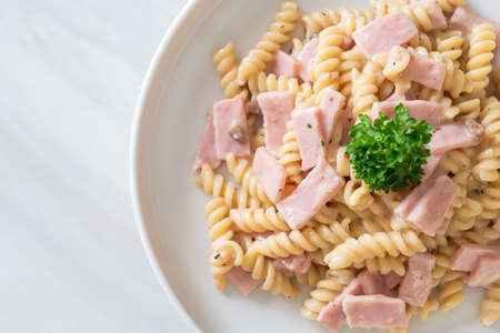 spirali or spiral pasta mushroom cream sauce with ham - Italian food styleの写真素材