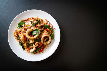 stir fried holy basil with octopus or squid and herb - Asian food styleの写真素材