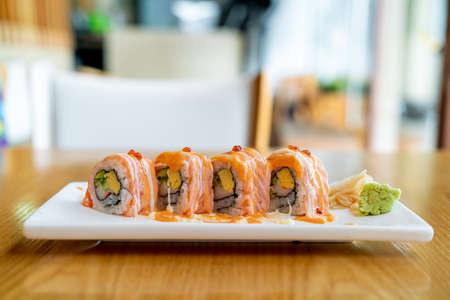 salmon roll sushi with sauce on top - Japanese food styleの写真素材