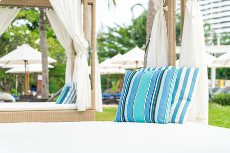 comfortable pillow on pavilion near beach - travel and vacation concept