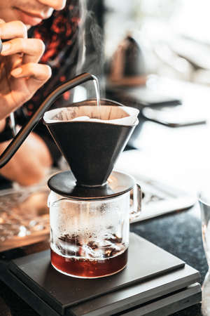 pouring hot water for dripping arabica coffee