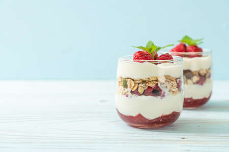 fresh raspberry and yogurt with granola - Healthy food styleの写真素材
