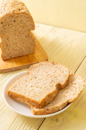 sliced wholegrain bread on a wooden table