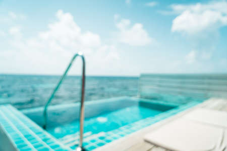 abstract blur and defocused swimming pool and sea background in Maldivesの写真素材