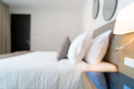 Abstract blur beautiful luxury hotel bedroom interior for backgroundの写真素材