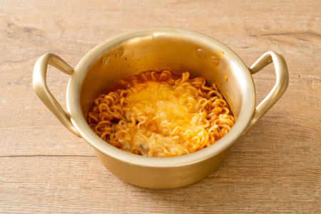 Korean spicy instant noodle bowl with mozzarella cheeseの写真素材