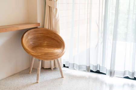 empty wood chair on corner in a roomの写真素材