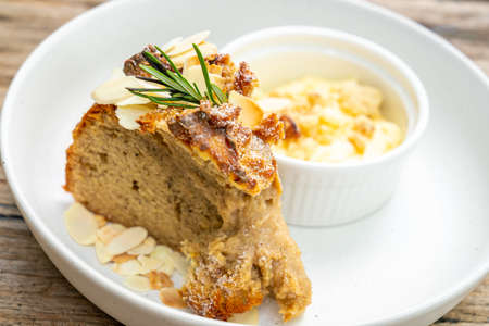 banana cake with cream cheese and crumble on plate