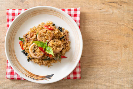 Homemade Basil and Spicy Herb Fried Rice with Squid or Octopus - Asian food styleの写真素材