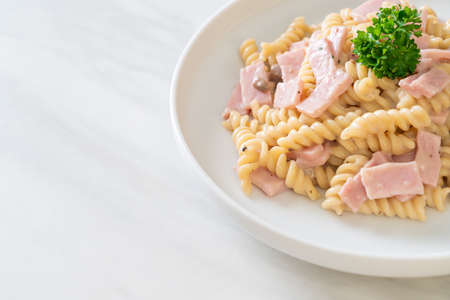 spirali or spiral pasta mushroom cream sauce with ham - Italian food styleの写真素材