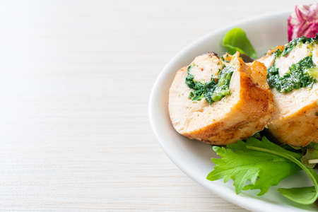 Baked chicken breast stuffed with cheese and spinachの写真素材