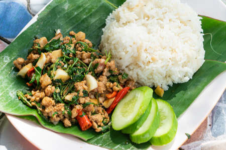 stir fried minced pork and basil with rice - Thai street food style