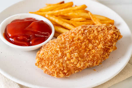 fried chicken breast fillet steak with French fries and ketchupの写真素材