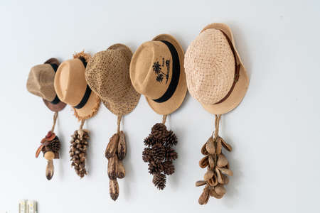 hat hanging on wall - decoration styleの写真素材