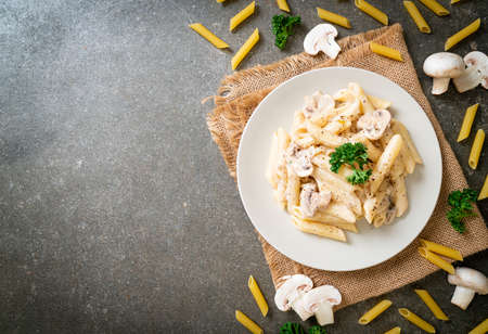 penne pasta carbonara cream sauce with mushroom - Italian food styleの写真素材