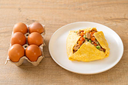 egg wrap or stuffed egg with minced pork, carrot, tomato and green pea