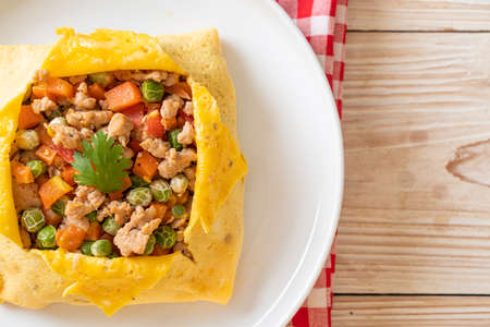 egg wrap or stuffed egg with minced pork, carrot, tomato and green pea