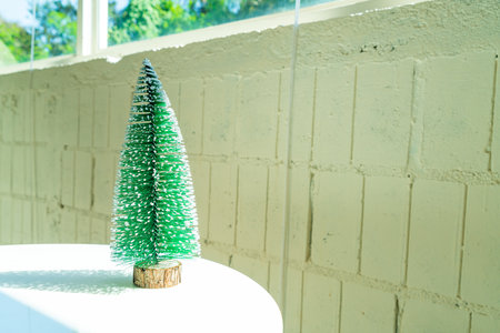 plastic Christmas tree decorate on table for christmas and happy new year festivalの写真素材