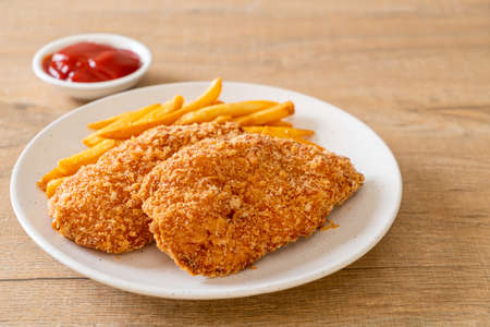fried chicken breast fillet steak with French fries and ketchupの写真素材