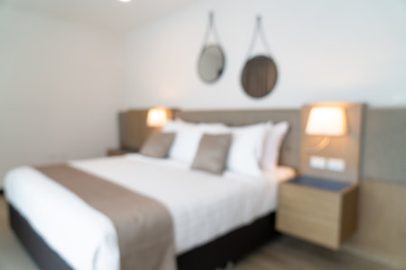 Abstract blur beautiful luxury hotel bedroom interior for backgroundの写真素材