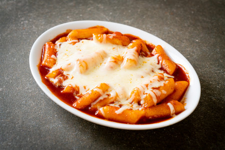 Korean rice cake in spicy Korean sauce with cheese, Cheese Tokpokki, Tteokbokki with Cheese - Korean food styleの写真素材
