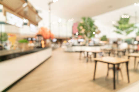abstract blur food court in shopping mall for background