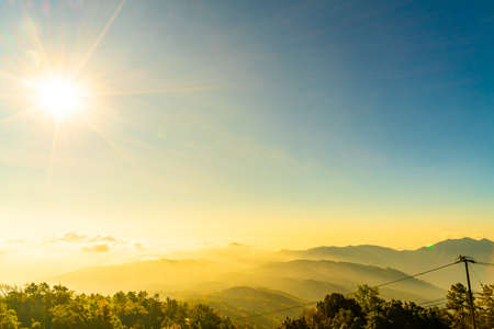 beautiful mountain layer with clouds and sunrise at Chiang Mai in Thailandの写真素材