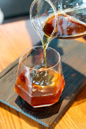 cold drip black coffee jar with glass and ice in coffee shop cafe and restaurantの写真素材