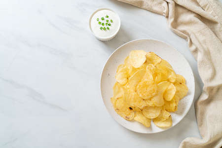 potato chips with sour cream dipping sauceの写真素材