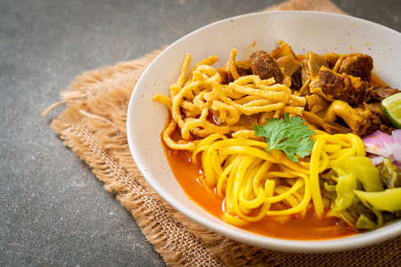 Northern Thai noodle curry soup with braised pork - Thai food styleの写真素材