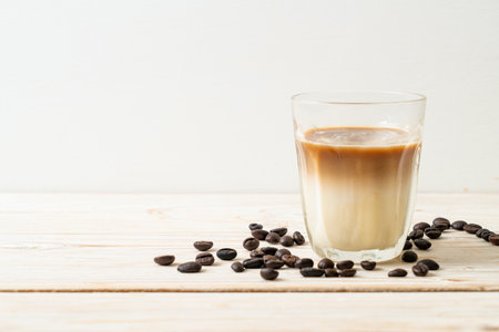 Dirty coffee glass, cold milk topped with hot espresso coffee shotの写真素材