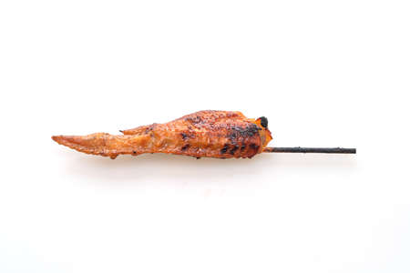 grilled or barbecue chicken wings skewer isolated on white backgroundの写真素材