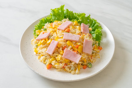 homemade fried rice with ham and mixed vegetable (carrot, green bean peas, carrot)の写真素材