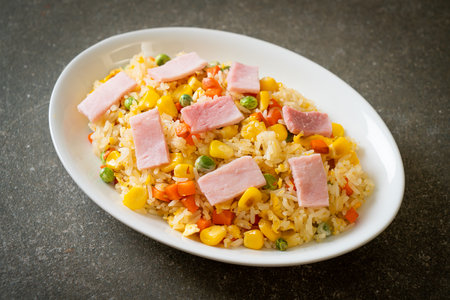 homemade fried rice with ham and mixed vegetable (carrot, green bean peas, carrot)の写真素材