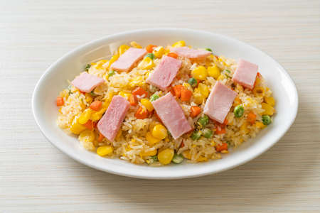 homemade fried rice with ham and mixed vegetable (carrot, green bean peas, carrot)の写真素材