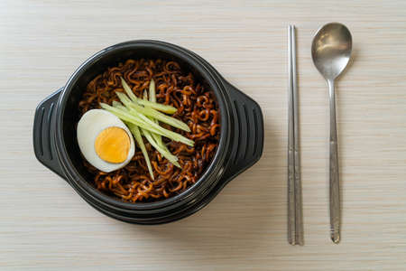 Korean Instant Noodle with Black Bean Sauce topped cucumber and boiled egg (Jajangmyeon or JJajangmyeon) - Korean food styleの写真素材
