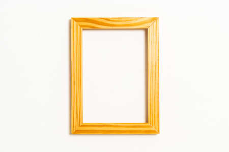 empty picture frame on white wall background with copy space