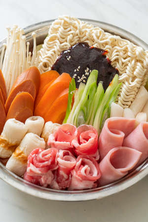 Budae Jjigae or Budaejjigae (Army stew or Army base stew). It is loaded with Kimchi, spam, sausages, ramen noodles and much more - popular Korean hot pot food styleの写真素材