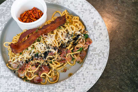 spaghetti aglio e olio with bacon - stir-fried spaghetti with garlic, olive oil, parsley, Parmigiano-Reggiano cheese tossed and baconの写真素材