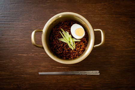 Korean Instant Noodle with Black Bean Sauce topped cucumber and boiled egg (Jajangmyeon or JJajangmyeon) - Korean food styleの写真素材