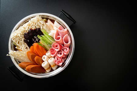 Budae Jjigae or Budaejjigae (Army stew or Army base stew). It is loaded with Kimchi, spam, sausages, ramen noodles and much more - popular Korean hot pot food styleの写真素材